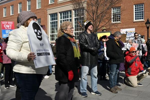 The crowd listens as Anne Arundel County Executive Steuart Pittman gives remarks. Protesters rally on President's Day at Lawyers Mall in Annapolis against the policies of President Do<em></em>nald Trump and Elon Musk as part of the natio<em></em>nwide "50501" Movement. (Paul W. Gillespie/Staff)