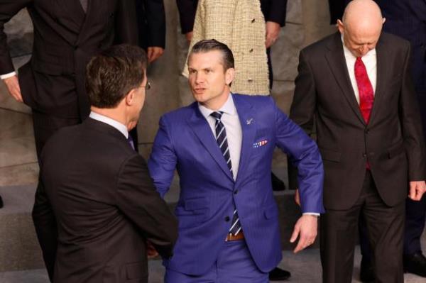 United States Secretary of Defense Pete Hegseth speaks with NATO Secretary General Mark Rutte